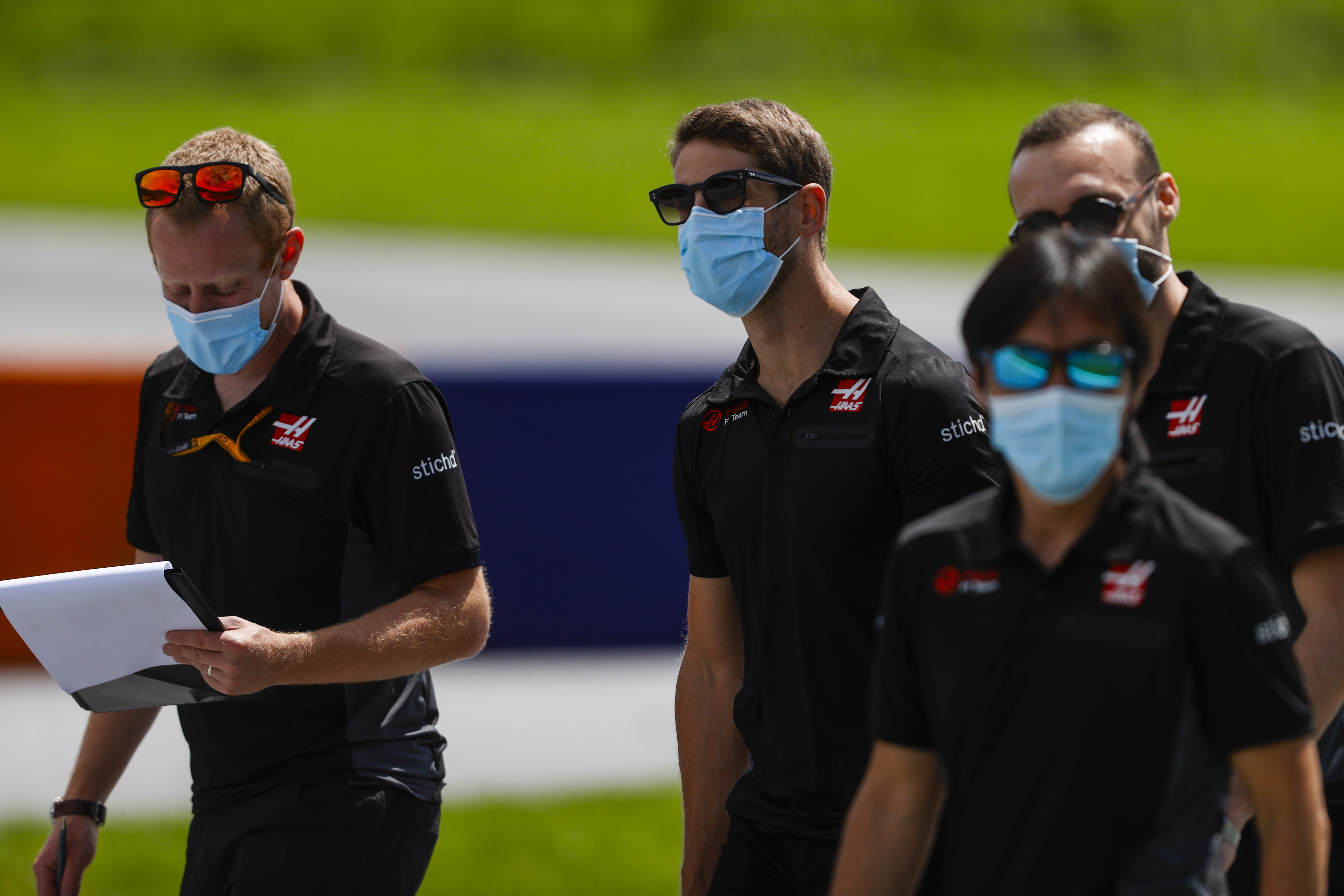 Romain Grosjean and Haas F1 Team Engineers